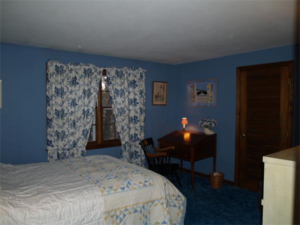 6 Pomfret Road Chelmsford, MA 01824 - Photo 9 of 14 a bedroom with a bed and a lamp on dresser