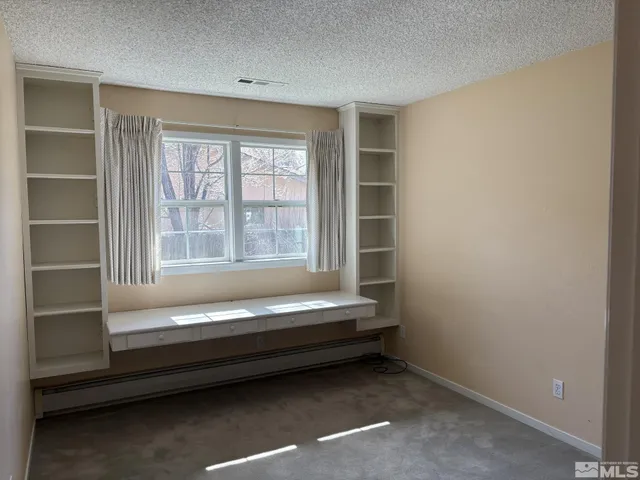 a bathroom with a bathtub and a window