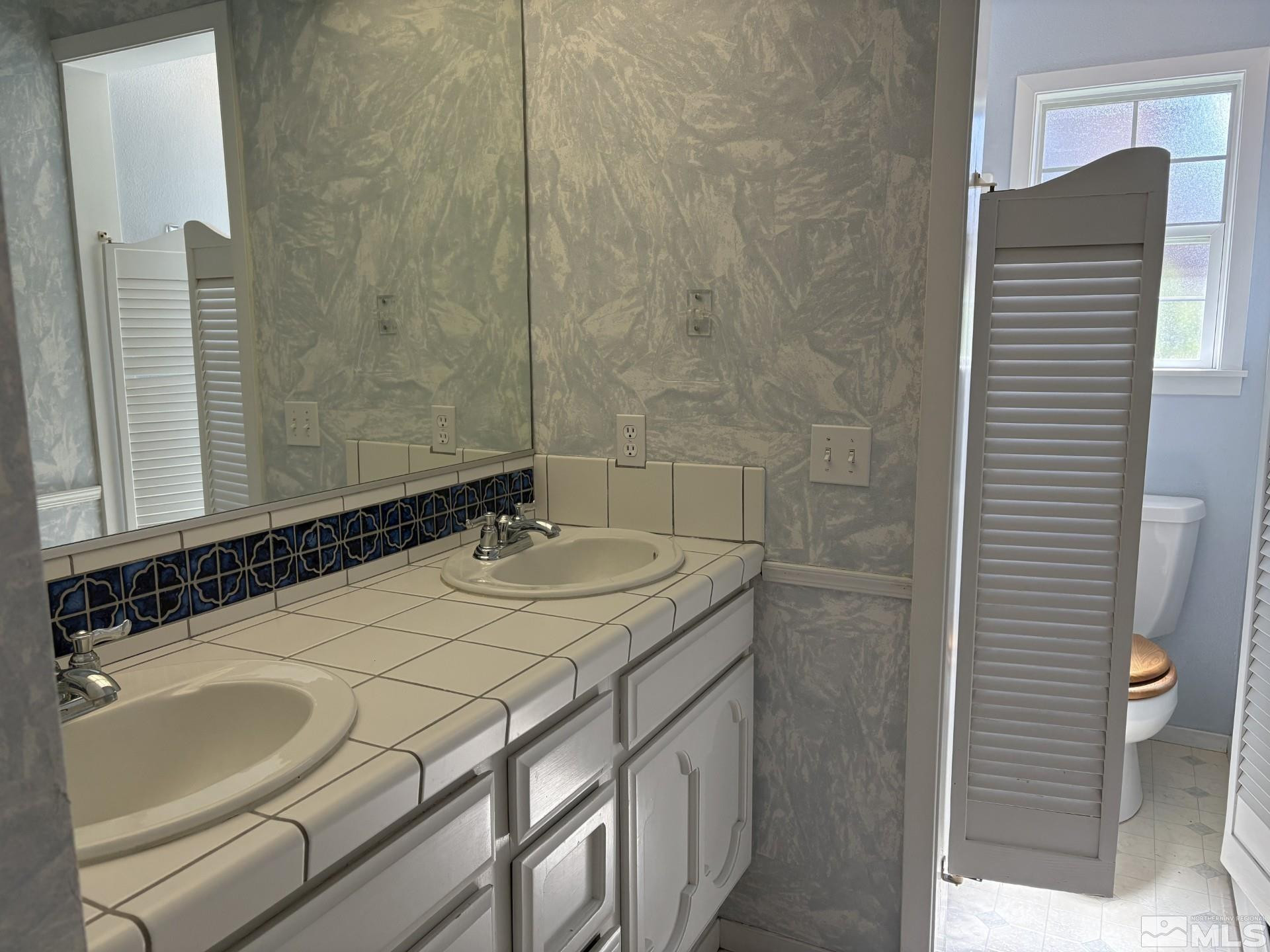 3 Comstock Circle Carson City, NV 89703 - Photo 16 of 30 a bathroom with a sink and a mirror