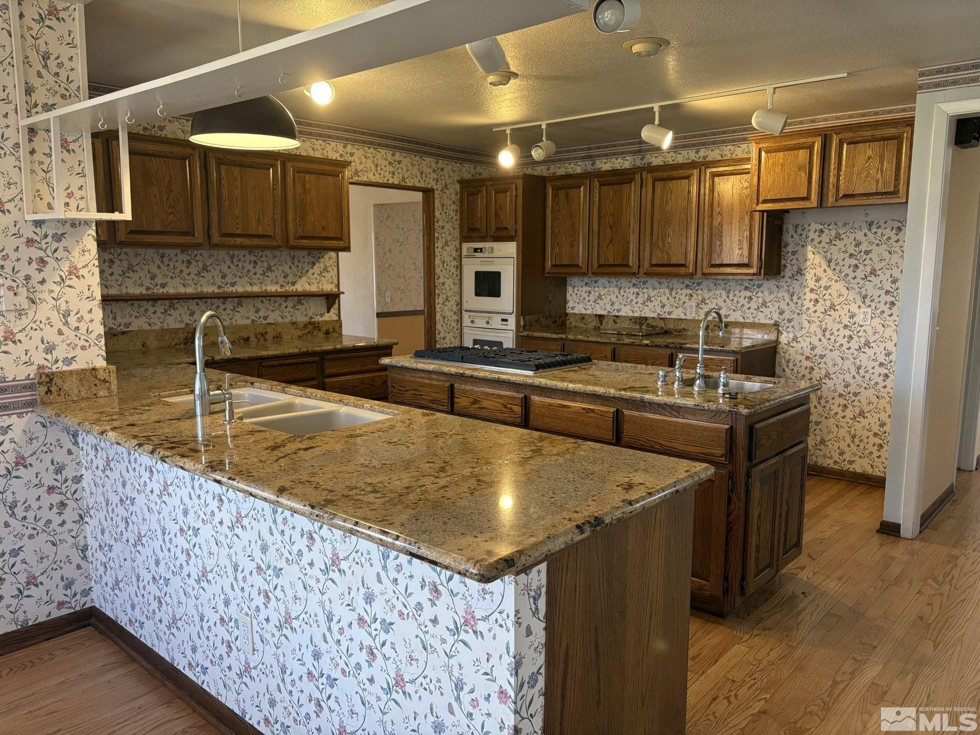3 Comstock Circle Carson City, NV 89703 - Photo 5 of 30 a kitchen with stainless steel appliances granite countertop a sink stove and cabinets