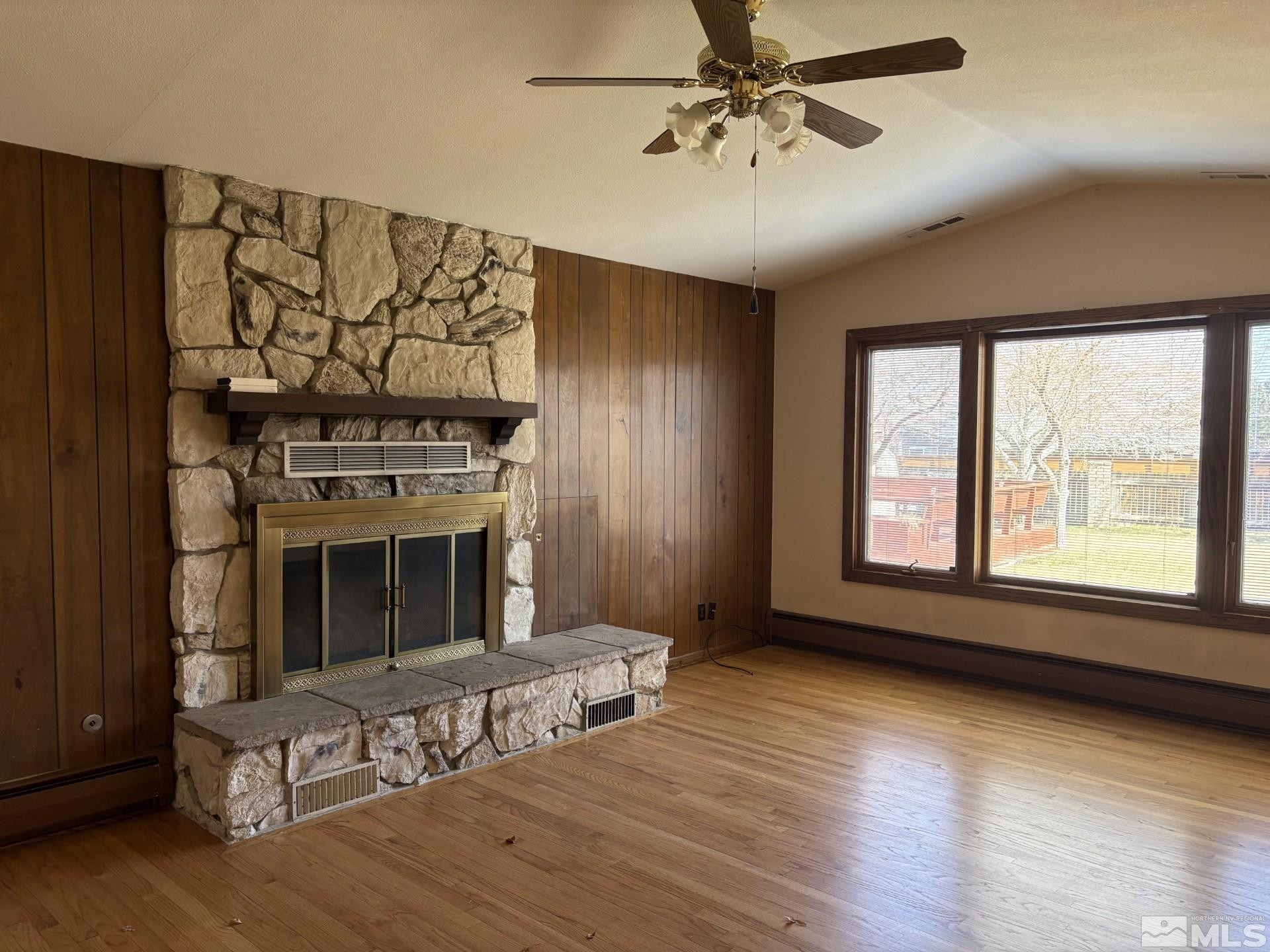 3 Comstock Circle Carson City, NV 89703 - Photo 10 of 30 a living room with wooden floors and a fireplace