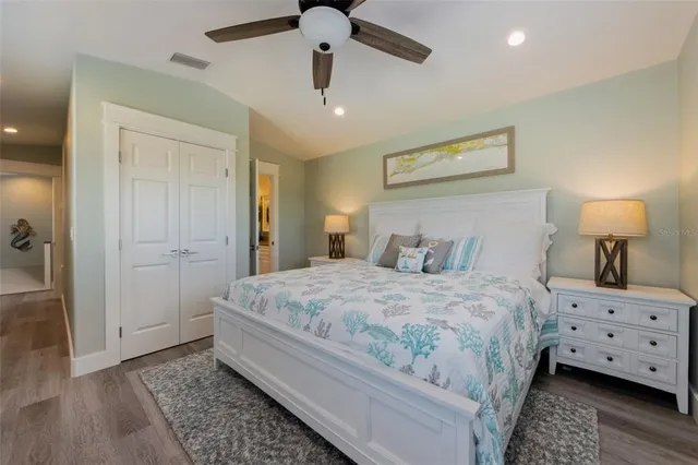 a bedroom with bed and window