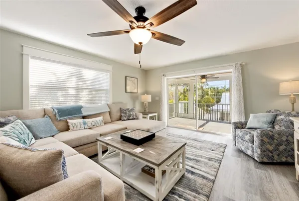 a living room with furniture and a large window