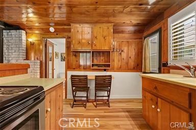 8 Oak Drive Mount Baldy, CA 91759 - Photo 20 of 26 a kitchen with a stove a sink and a refrigerator