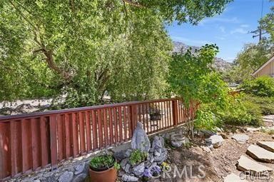 8 Oak Drive Mount Baldy, CA 91759 - Photo 7 of 26 a view of a backyard with plants and wooden fence
