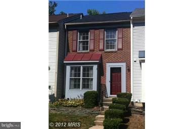 8575 Springfield Oaks Drive Springfield, VA 22153 - Photo 1 of 11 a view of a brick house with a large windows