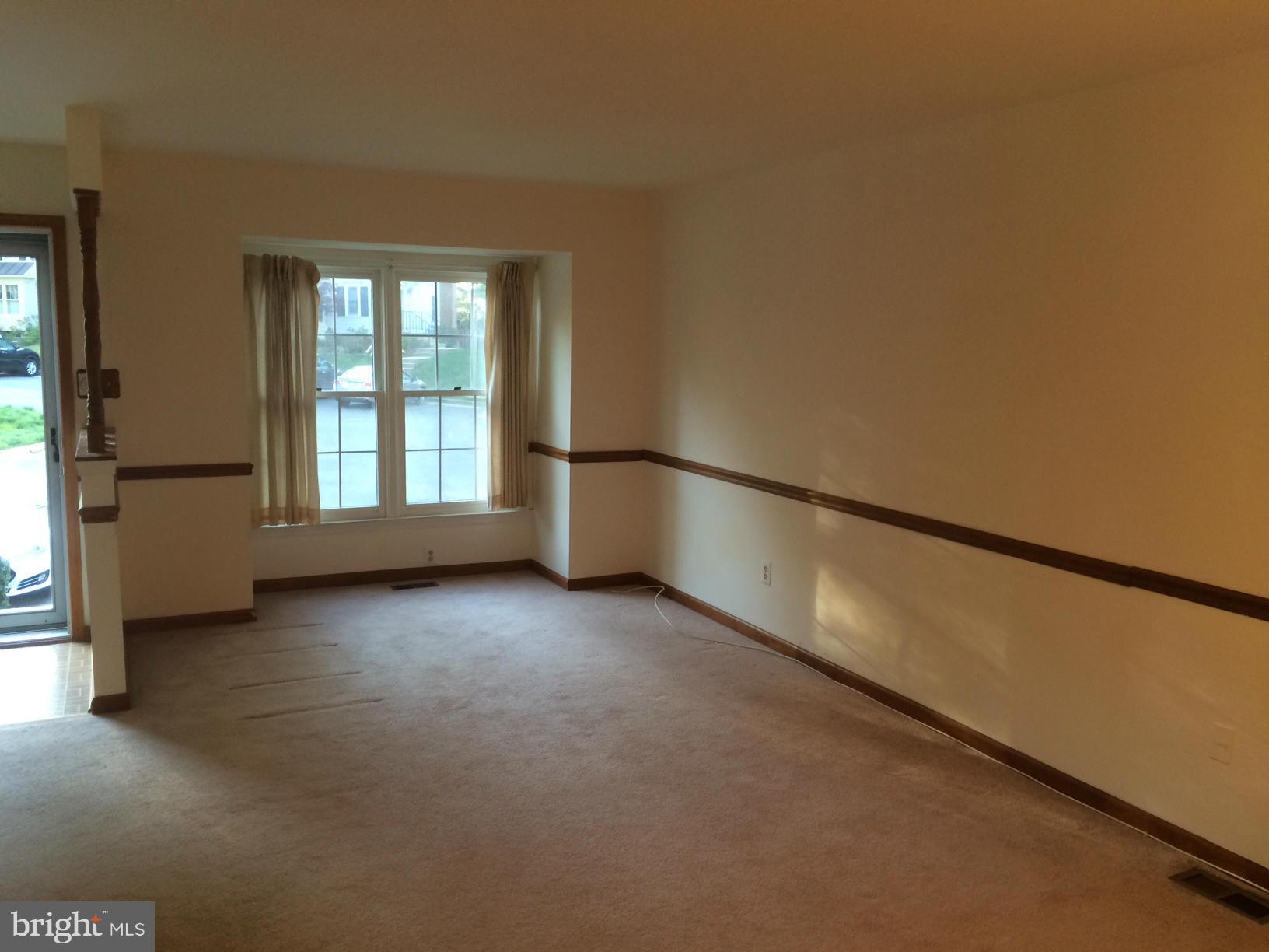 8575 Springfield Oaks Drive Springfield, VA 22153 - Photo 2 of 11 a view of an empty room with a window
