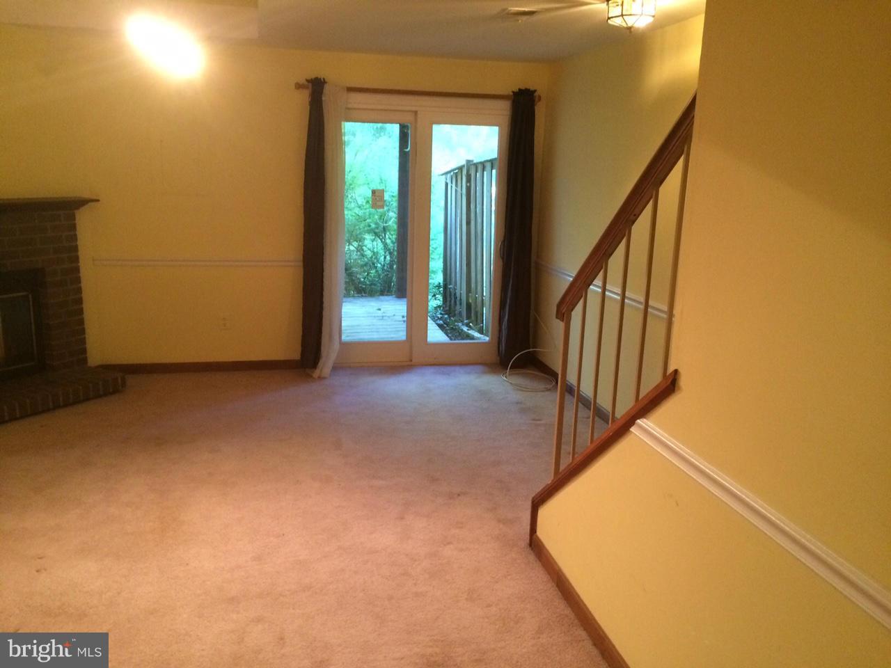 8575 Springfield Oaks Drive Springfield, VA 22153 - Photo 5 of 11 a view of a hallway with staircase