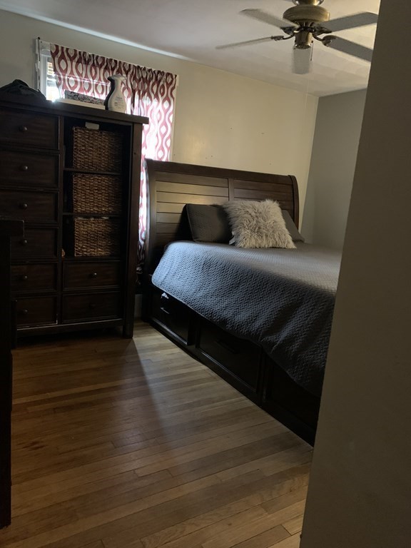 133 Regal Street Springfield, MA 01118 - Photo 8 of 18 a bedroom with a bed and a ceiling fan