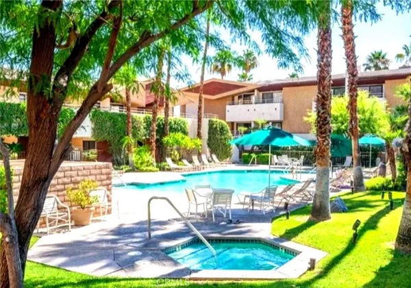 a view of a swimming pool with a patio