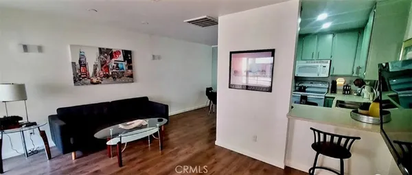 a view of a livingroom with furniture and a workspace