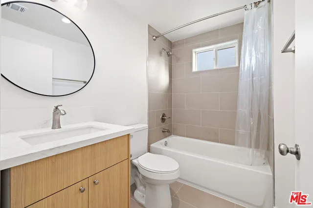 a view of a street with cars