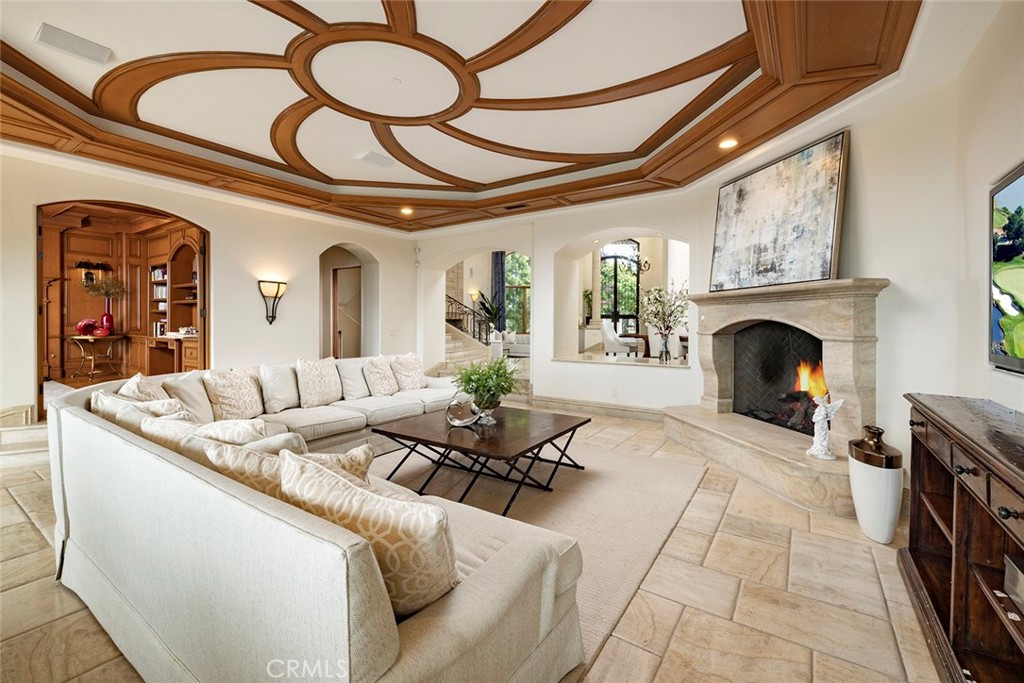 5 Sailview Newport Coast, CA 92657 - Photo 13 of 37 a living room with furniture and a fireplace