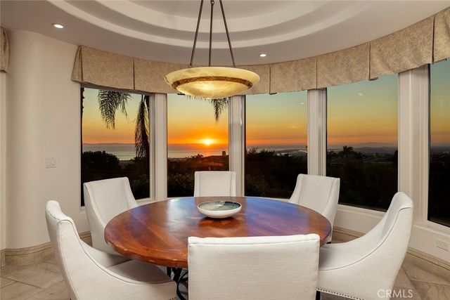 a kitchen with stainless steel appliances granite countertop a sink and a wooden floor