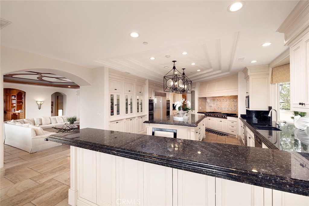 5 Sailview Newport Coast, CA 92657 - Photo 19 of 37 a large kitchen with granite countertop a large counter top appliances and cabinets