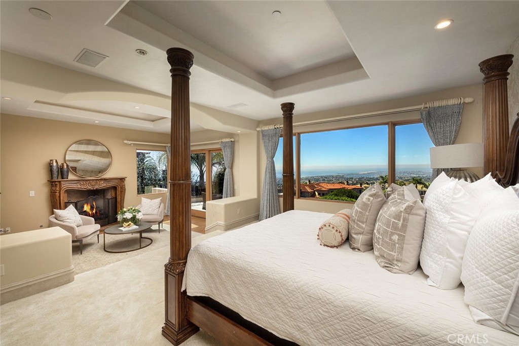 5 Sailview Newport Coast, CA 92657 - Photo 20 of 37 a bedroom with a bed and a mirror