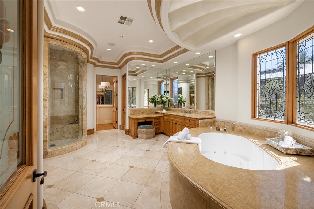 5 Sailview Newport Coast, CA 92657 - Photo 21 of 37 a spacious bathroom with a granite countertop sink and a mirror