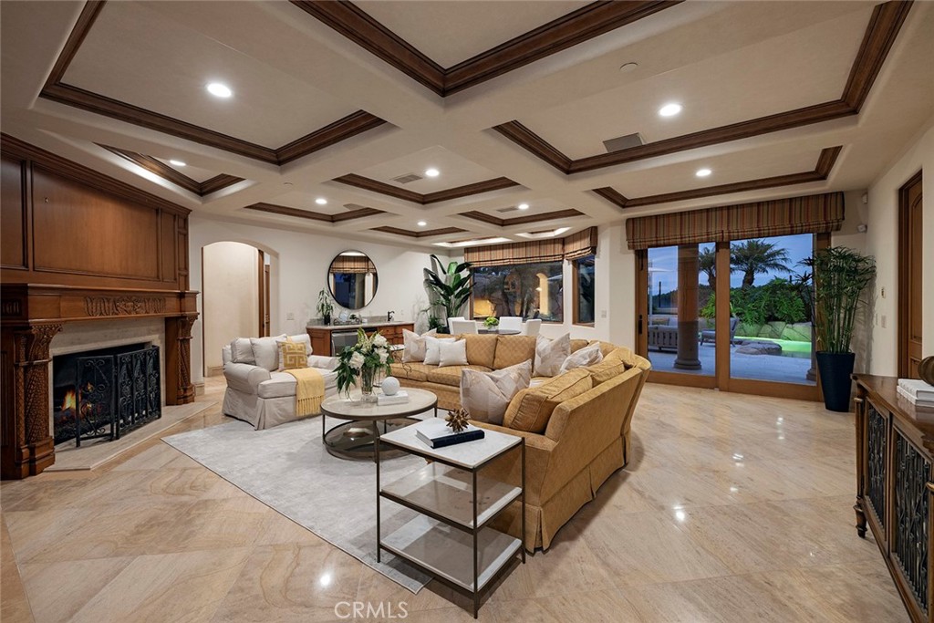 5 Sailview Newport Coast, CA 92657 - Photo 24 of 37 a living room with furniture a fireplace and a flat screen tv