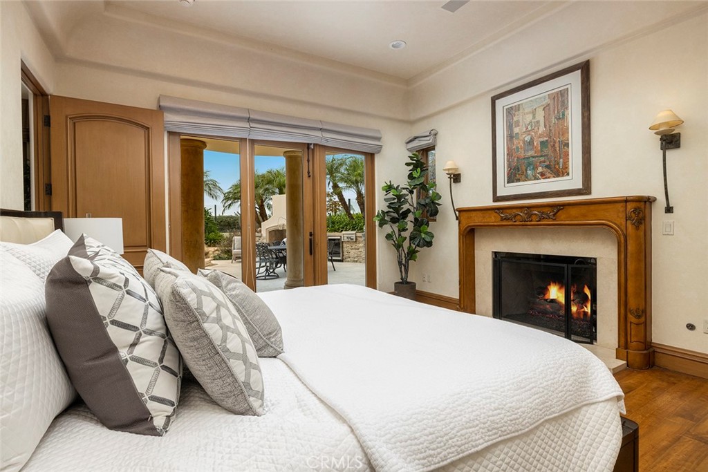 5 Sailview Newport Coast, CA 92657 - Photo 26 of 37 a spacious bedroom with a bed and a large window