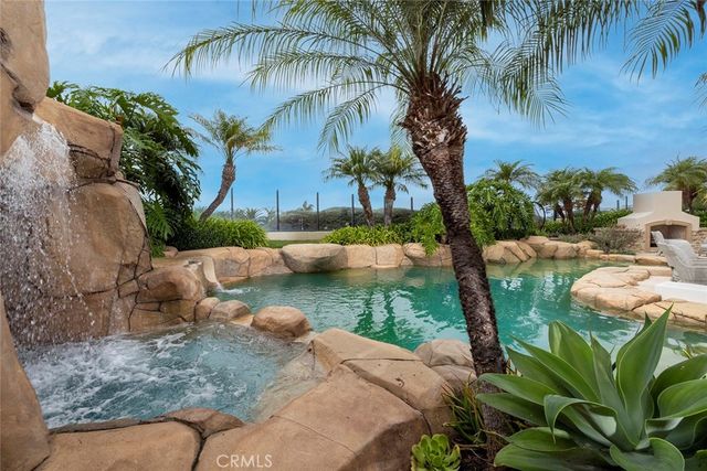a view of swimming pool with outdoor seating