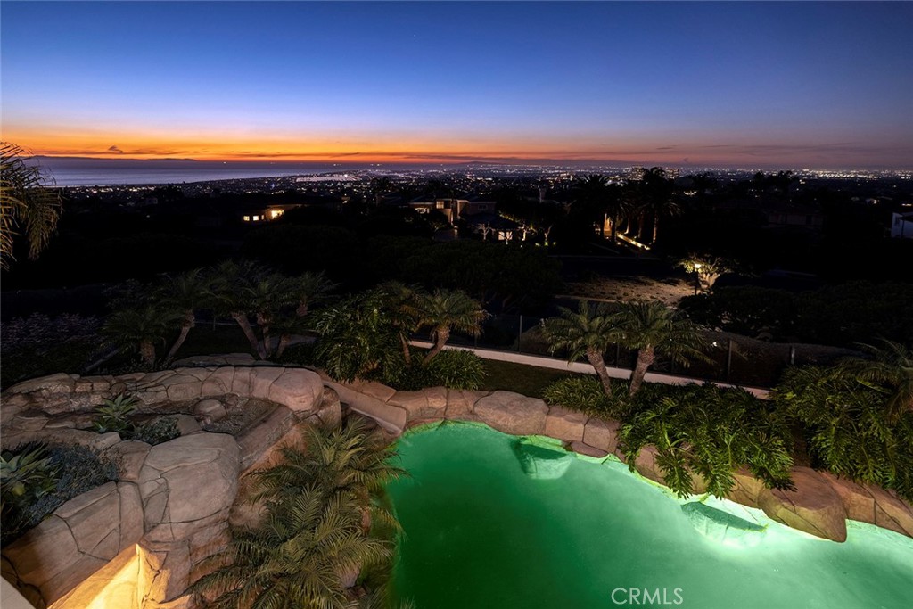 5 Sailview Newport Coast, CA 92657 - Photo 37 of 37 a view of a backyard of a house with a yard fire pit and outdoor seating