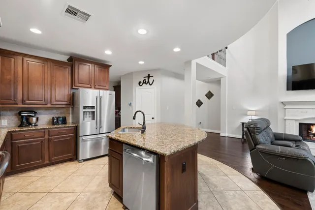 a kitchen with refrigerator cabinets and furniture