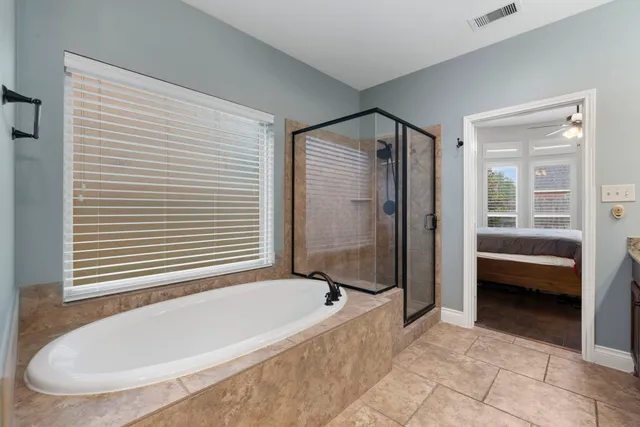 a bathroom with a tub and a shower
