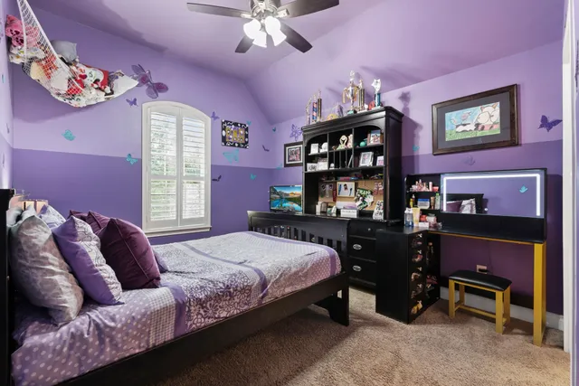 a bedroom with a bed piano and a window