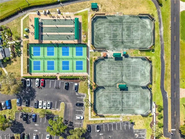 an aerial view of residential houses with outdoor space