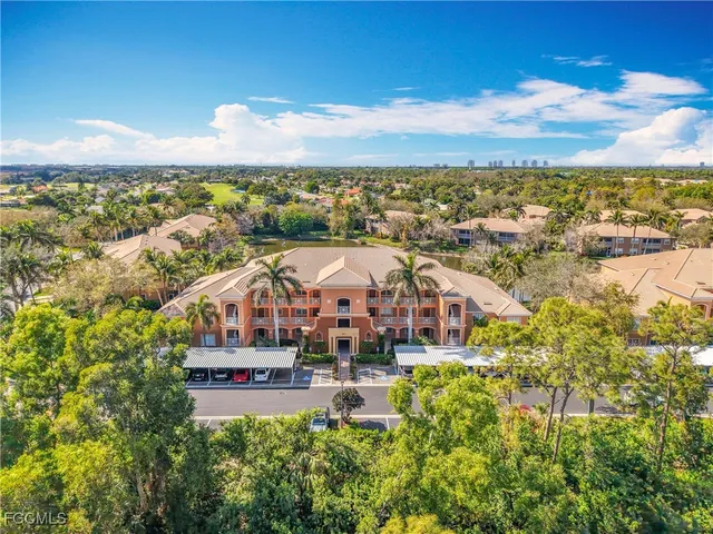 a front view of a building with glass windows and a chandelier