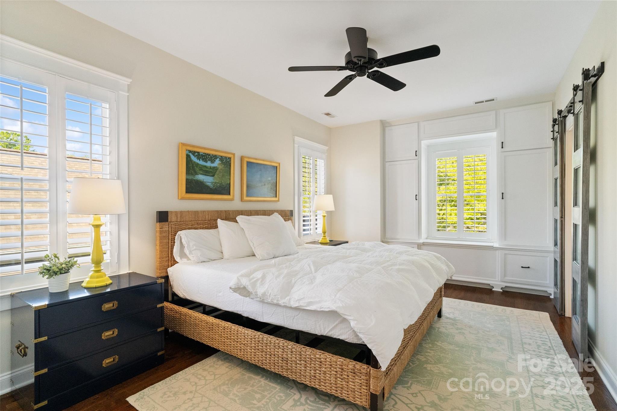 6165 Caseys Side Way Fort Mill, SC 29708 - Photo 15 of 34 a bedroom with a bed a window and a chandelier