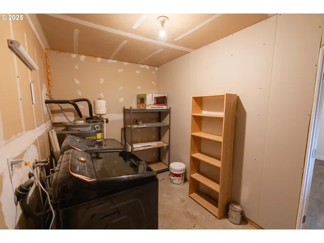 a kitchen with a sink appliances and cabinets
