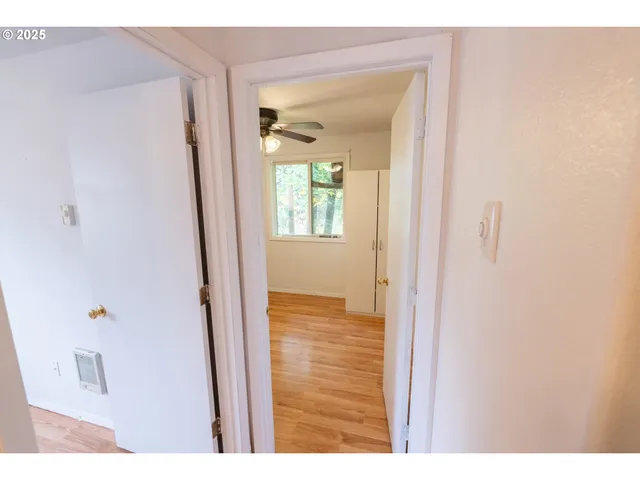 a view of a bathroom from a hallway