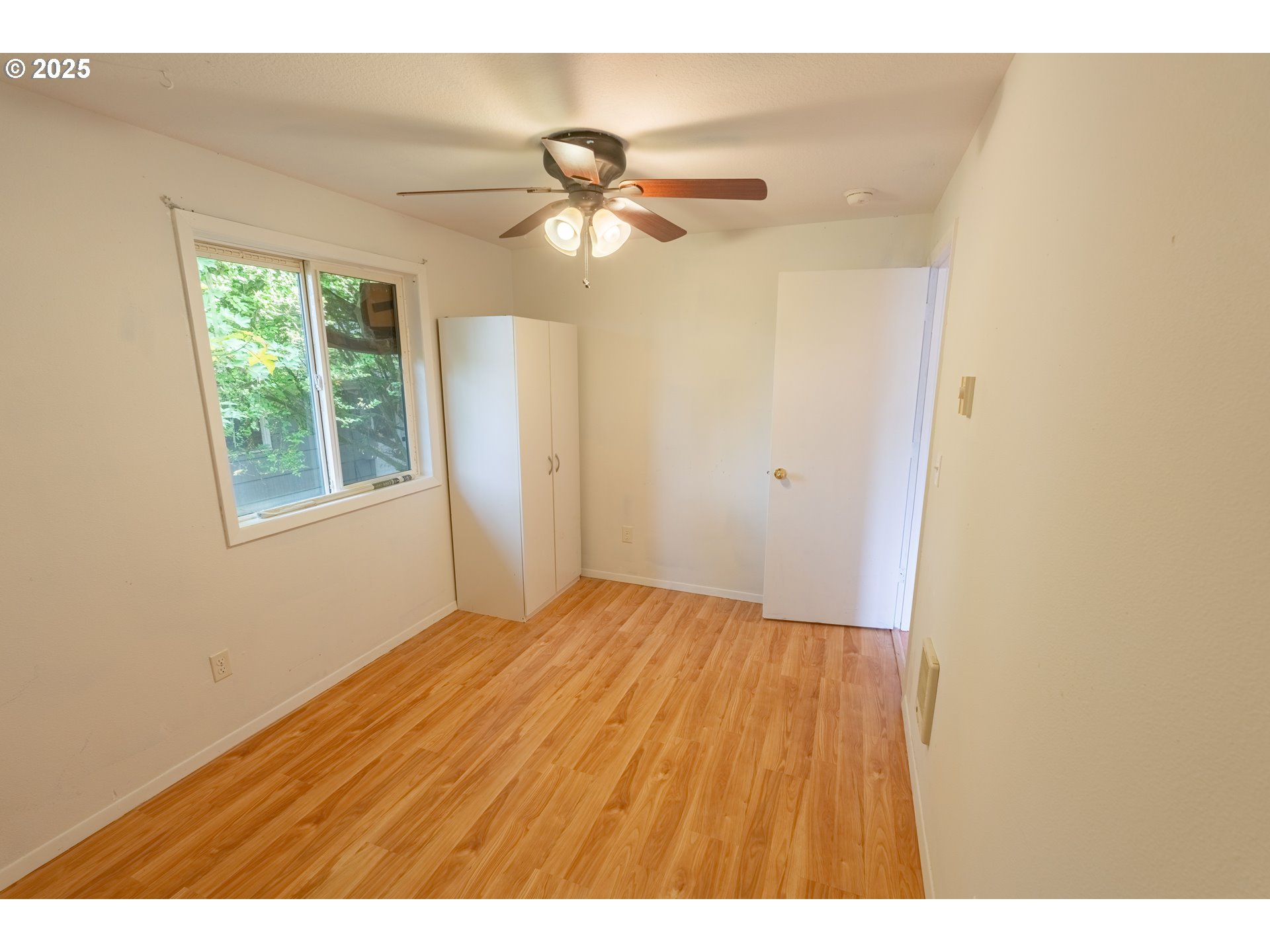 219 Northeast 18th Avenue Camas, WA 98607 - Photo 20 of 34 a view of empty room with wooden floor and fan