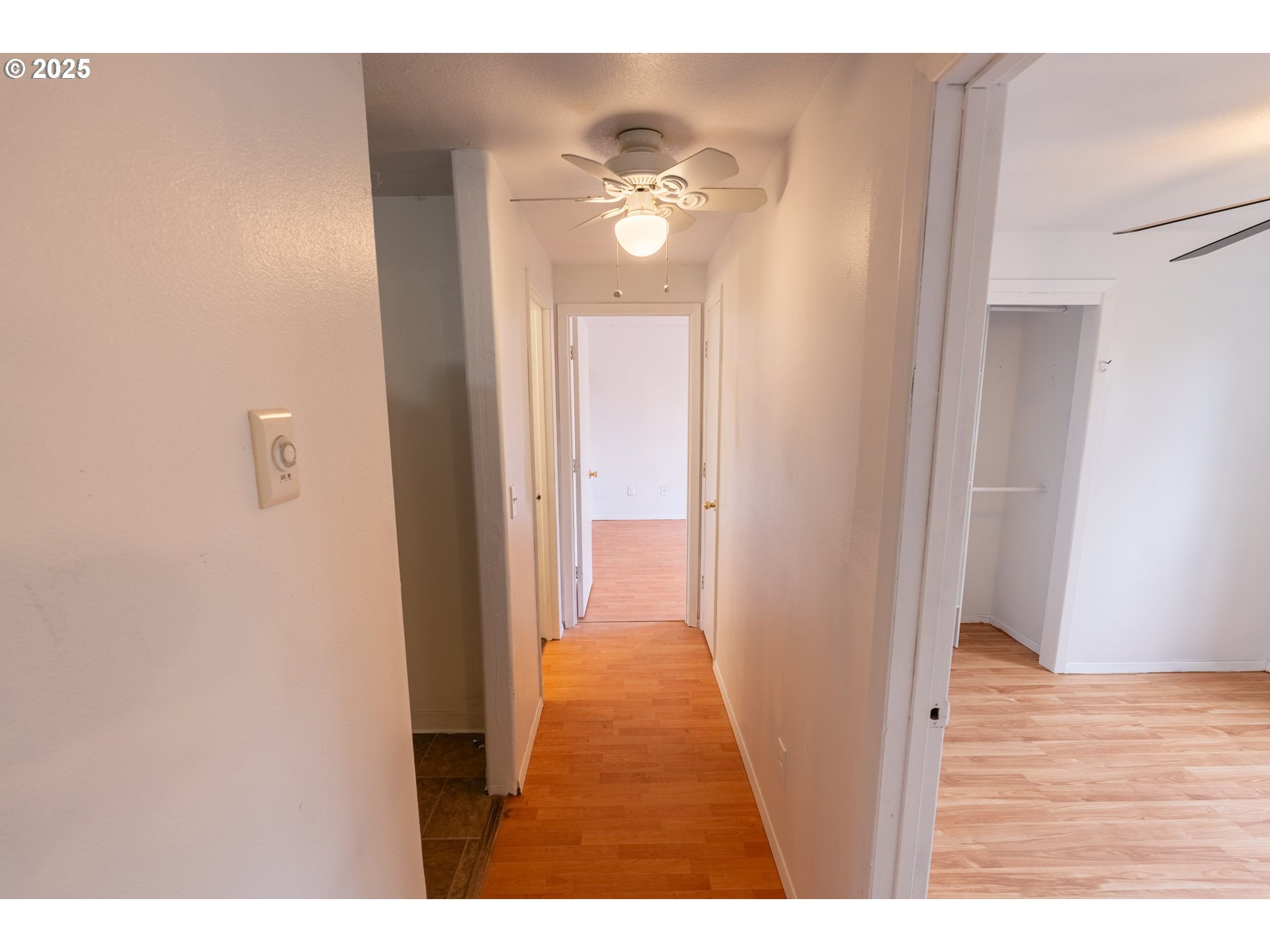 219 Northeast 18th Avenue Camas, WA 98607 - Photo 21 of 34 a view of a hallway with wooden floor