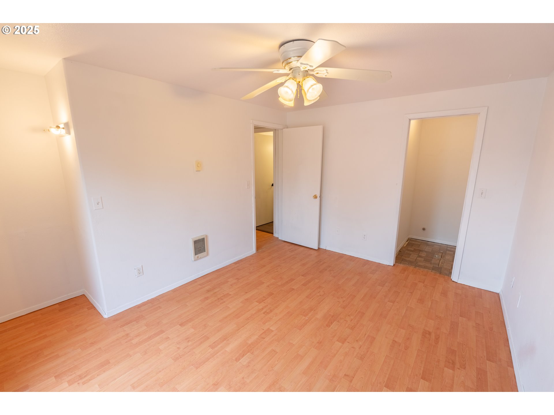 219 Northeast 18th Avenue Camas, WA 98607 - Photo 27 of 34 a bedroom with a bed and a chandelier