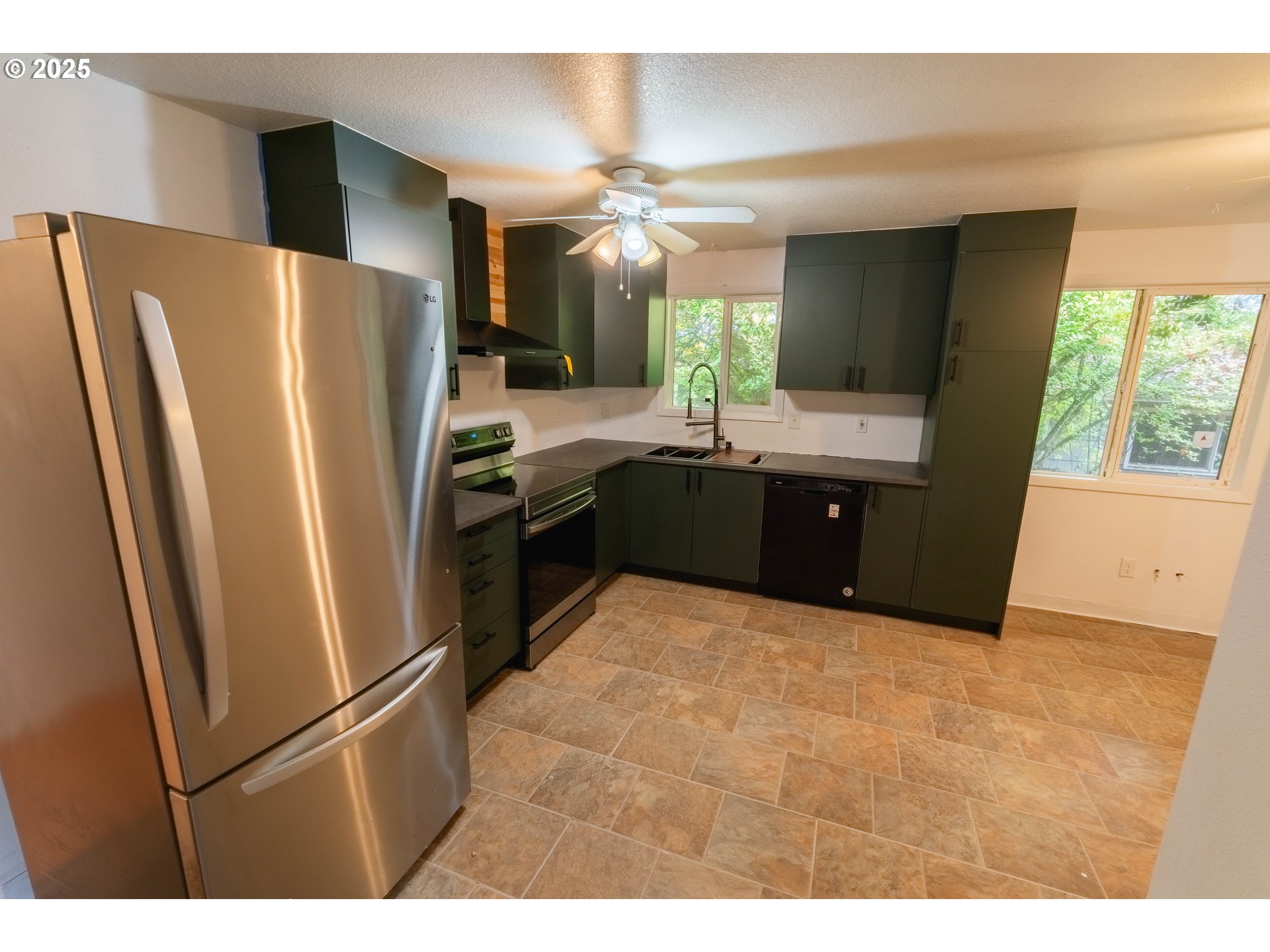 219 Northeast 18th Avenue Camas, WA 98607 - Photo 10 of 34 a kitchen with stainless steel appliances a refrigerator and a sink