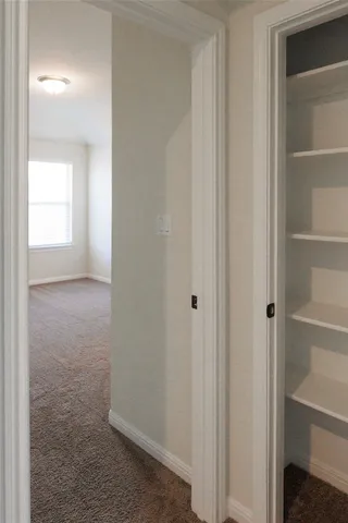 a view of hallway with closet