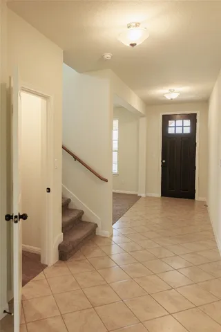 a view of a hallway view with staircase