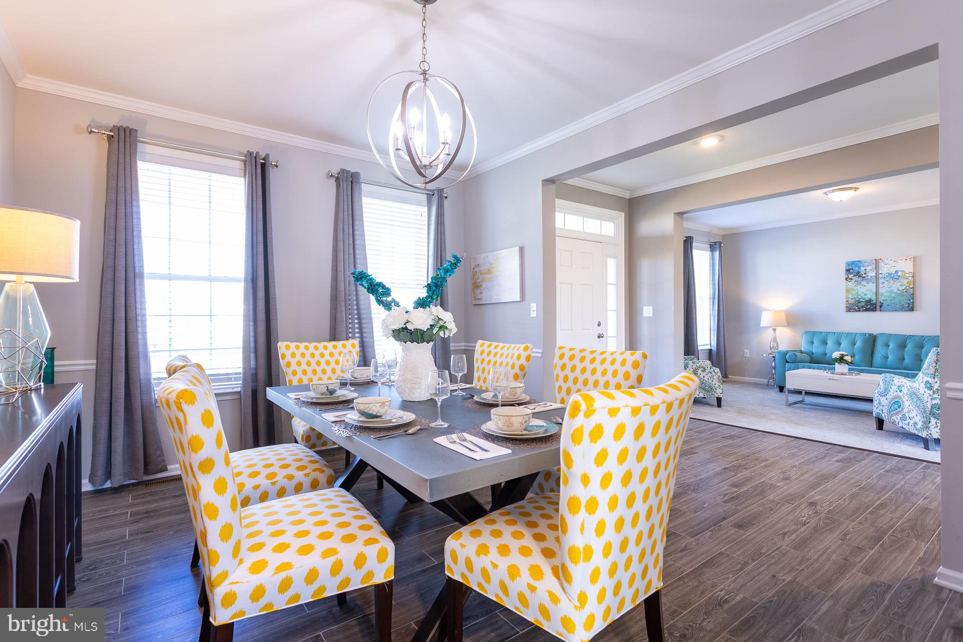 668 Marquee Farm Road Charles Town, WV 25414 - Photo 13 of 50 a view of a dining room with furniture and wooden floor