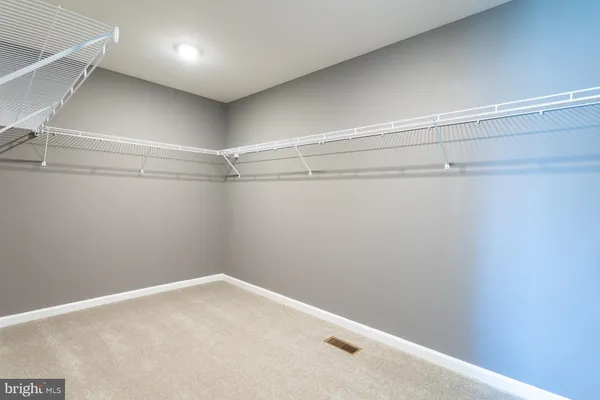 a view of a room with racks on the wall