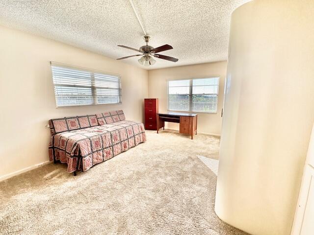 4001 Hythe A Boca Raton, FL 33434 - Photo 12 of 38 a spacious bedroom with a bed and a window