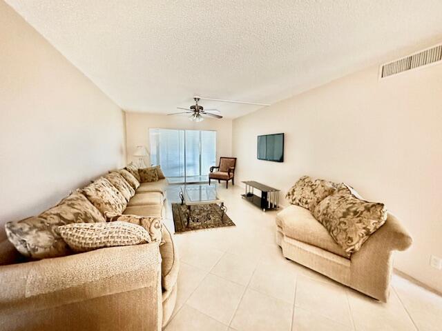 4001 Hythe A Boca Raton, FL 33434 - Photo 5 of 38 a living room with furniture window and a lamp