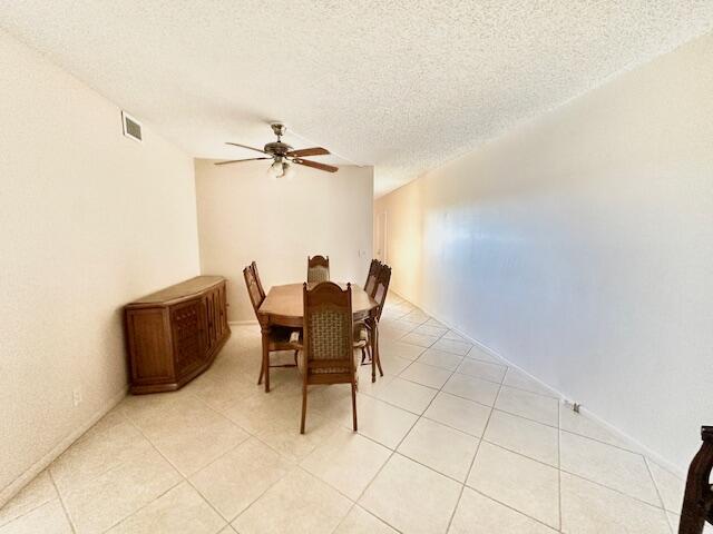 4001 Hythe A Boca Raton, FL 33434 - Photo 6 of 38 a dining room with furniture and a ceiling fan
