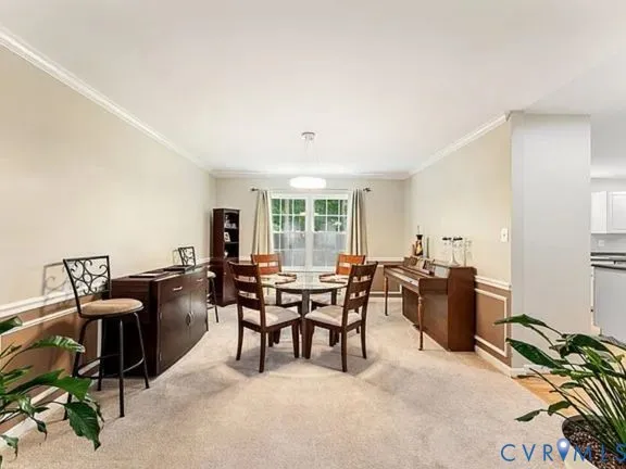 a living room with furniture a large window and a table