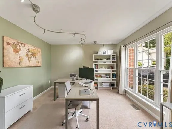 a view of a workspace with furniture