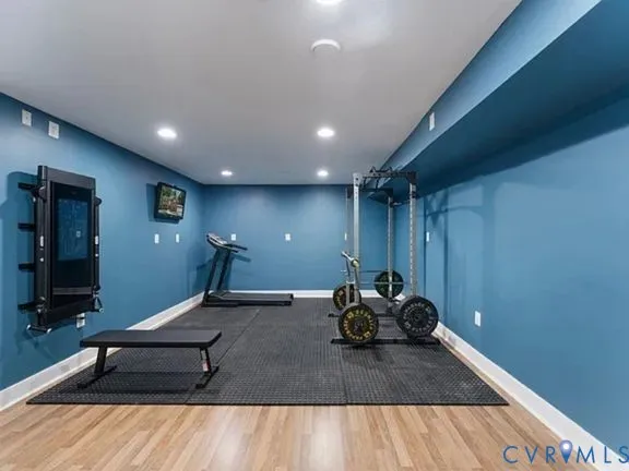 a room with gym equipment and a large window