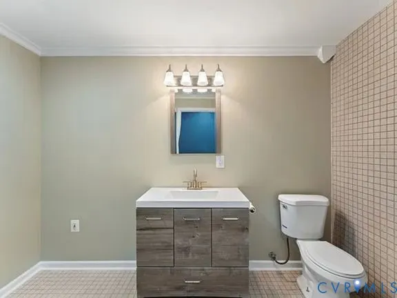 a bathroom with a sink toilet and a mirror