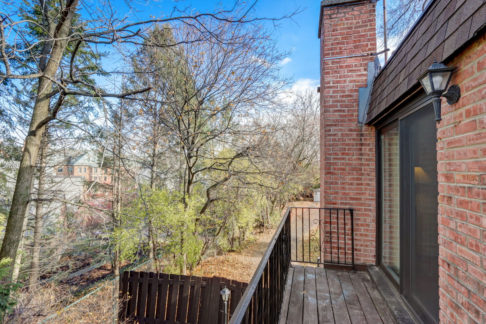 550 East Main Street, Unit 2E Barrington, IL 60010 - Photo 14 of 19 a view of balcony with wooden floor and fence