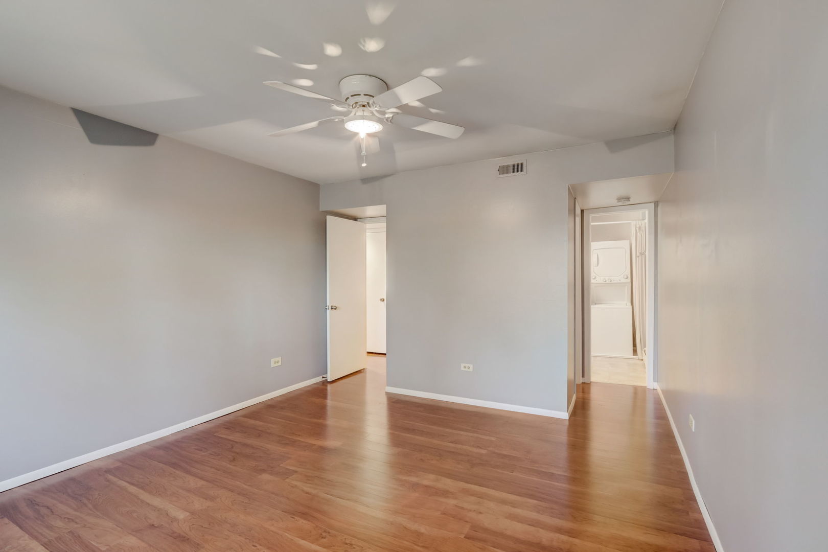 550 East Main Street, Unit 2E Barrington, IL 60010 - Photo 8 of 19 a view of an empty room with wooden floor
